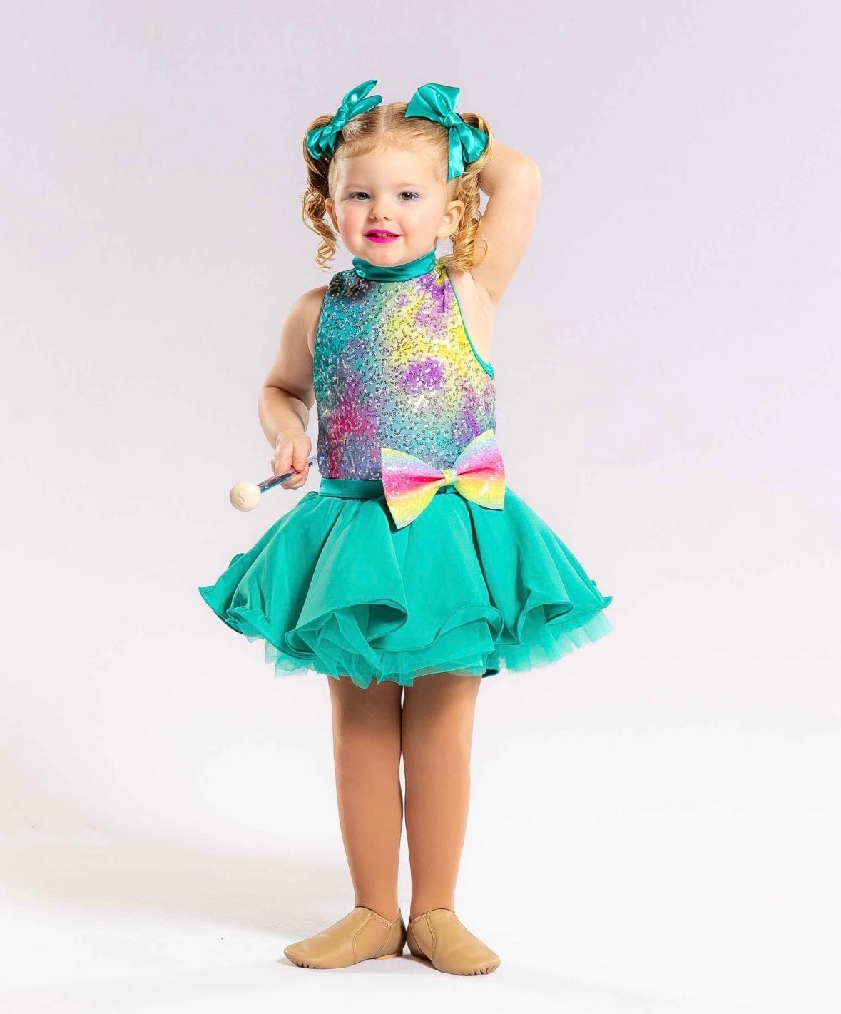 Children performing baton twirling at a recital